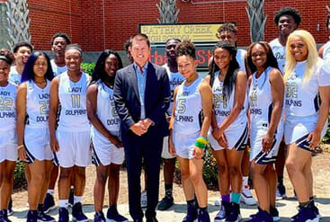 A group of women's basketball players posing for a picture, with no personal injury lawyer or attorney involvement.