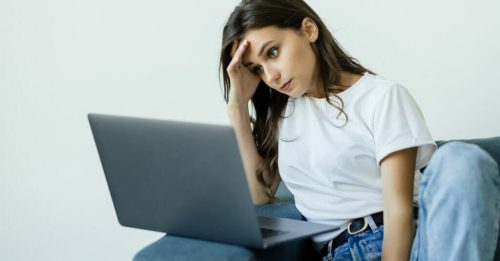 Woman looking at a laptop